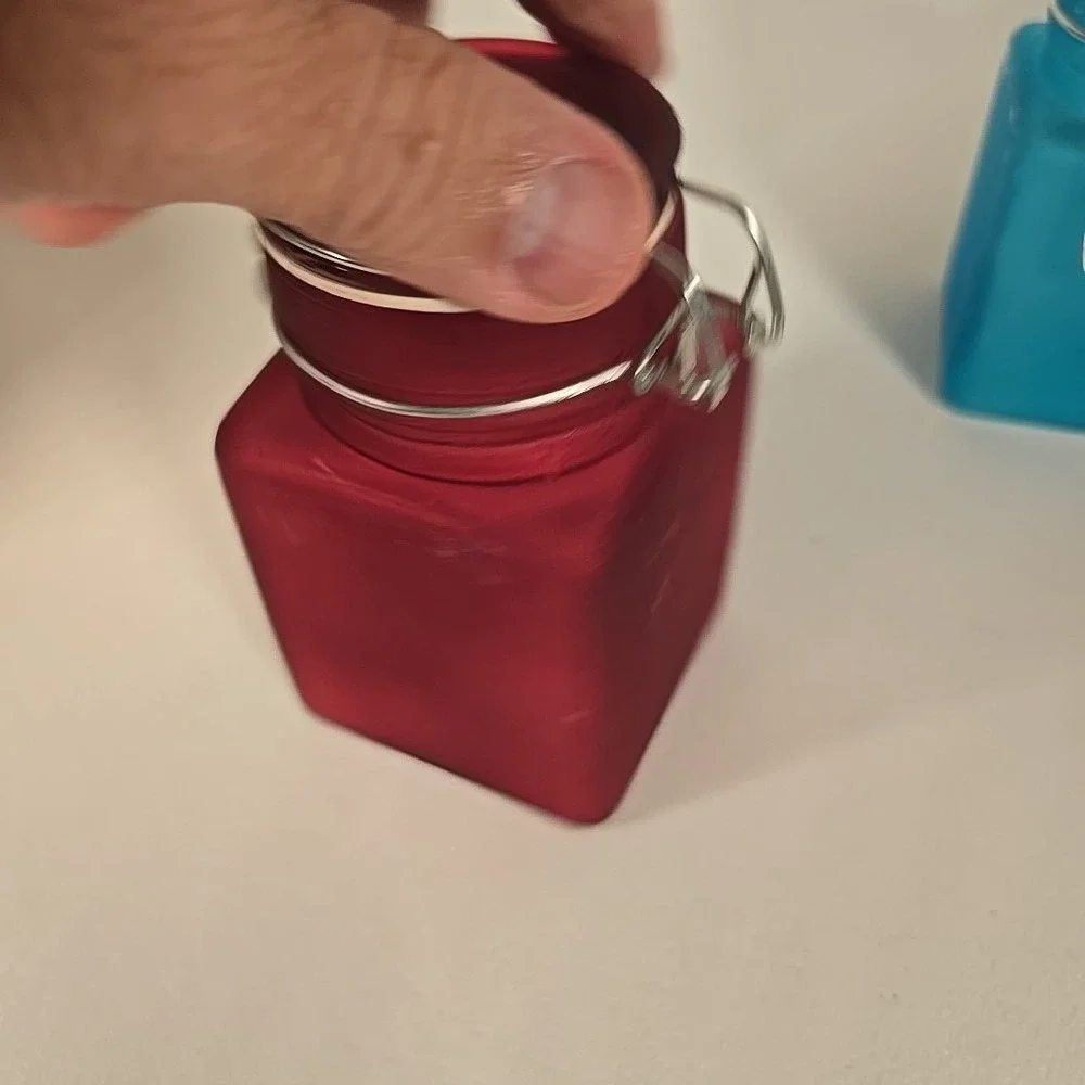 Set Of Four Colored‎ Glass Cannisters With Locking Tops Very Good Condition